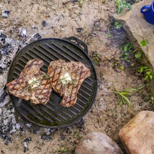 Lodge Cast Iron Cook-It-All Kit. Five-Piece Cast Iron Set includes a Reversible Grill/Griddle 14 Inch, 6.8 Quart Bottom/Wok, Two Heavy Duty Handles, and a Tips & Tricks Booklet.