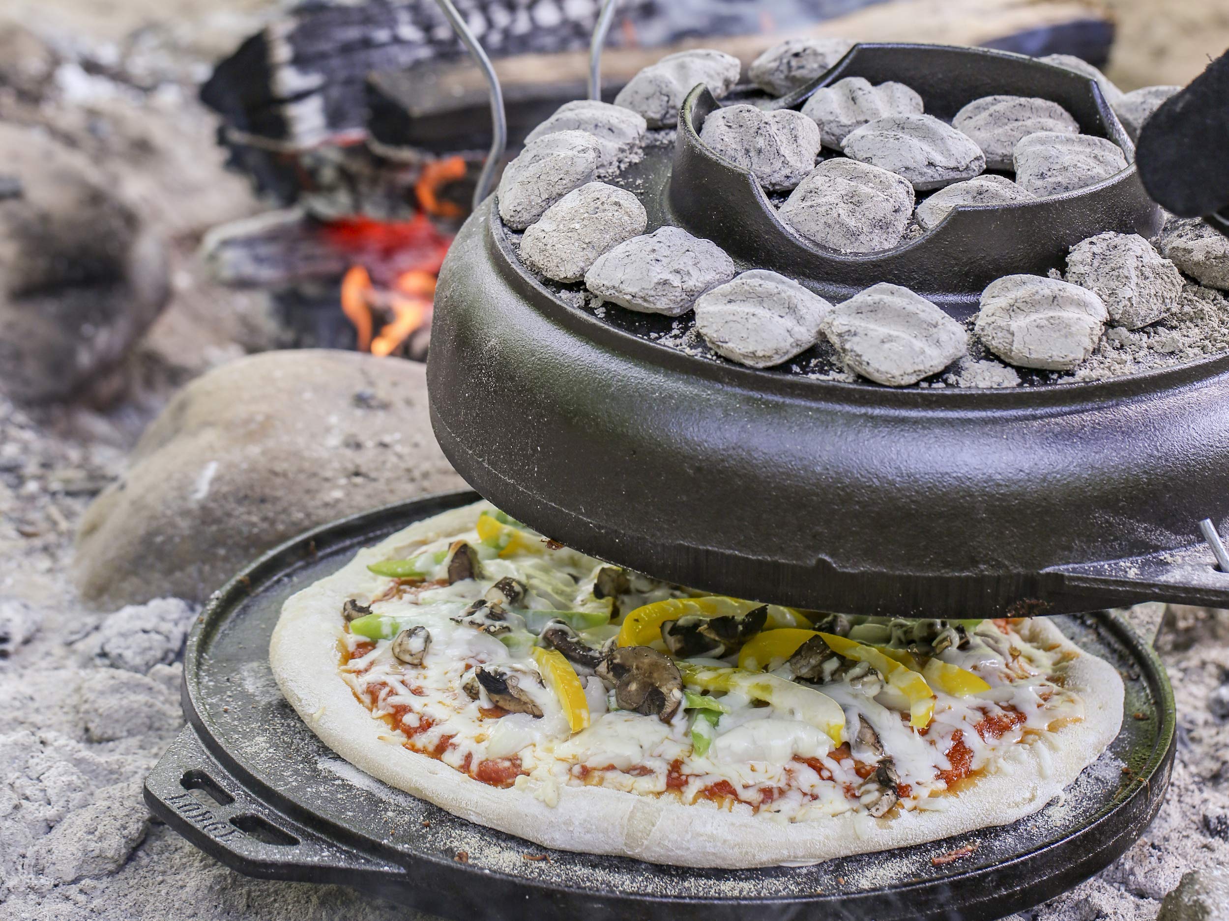 Lodge Cast Iron Cook-It-All Kit. Five-Piece Cast Iron Set includes a Reversible Grill/Griddle 14 Inch, 6.8 Quart Bottom/Wok, Two Heavy Duty Handles, and a Tips & Tricks Booklet.