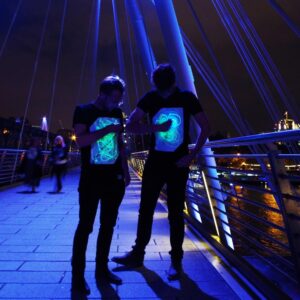 Illuminated Apparel Interactive Glow in The Dark T-Shirt - Fun for Birthday Parties & Festivals (Black/Green Glow, 7-8 Years)