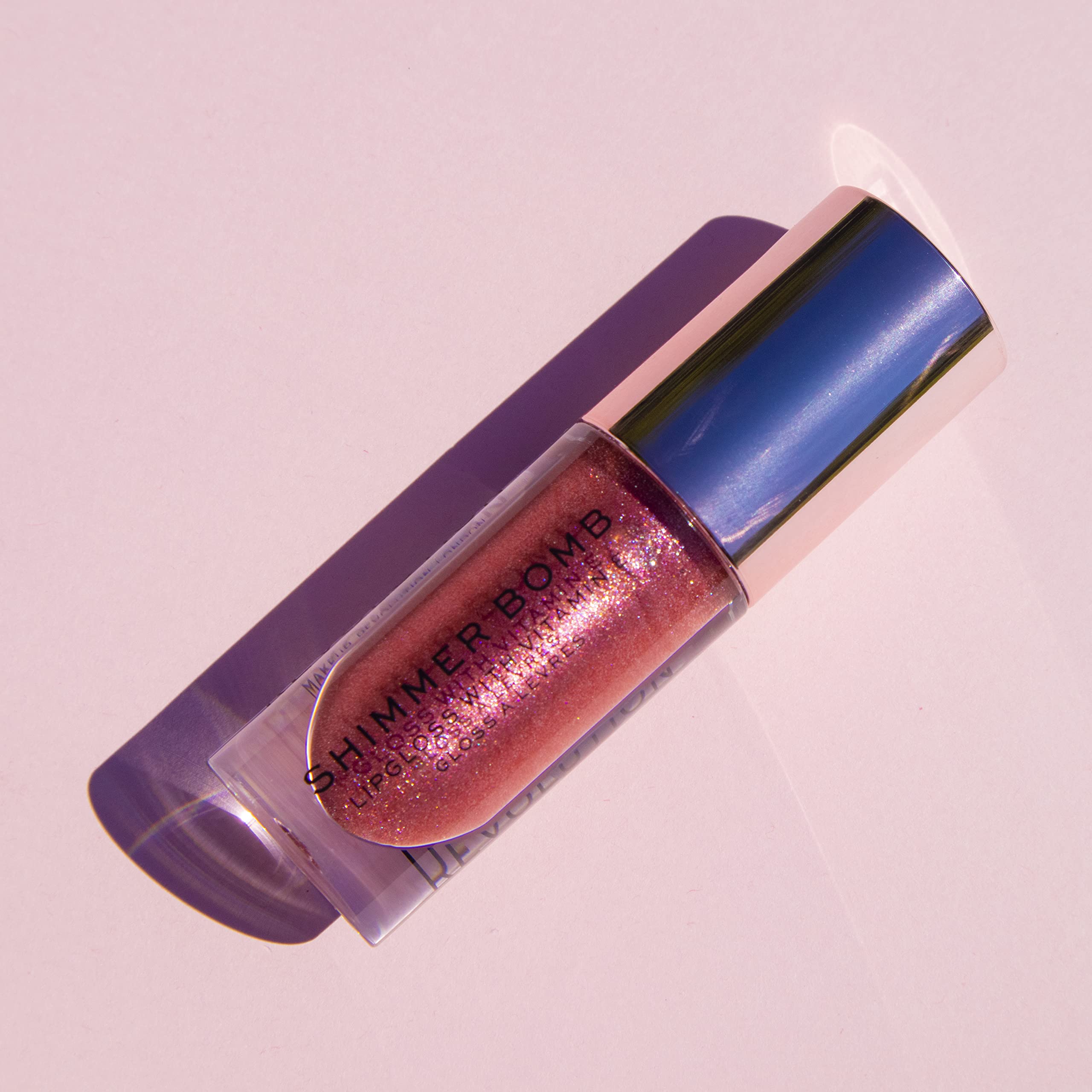 Revolution Shimmer Bomb Lip Gloss, Lip Tint Infused With Vitamin E, Shimmery Finish, Comes In 6 Colors, Distortion