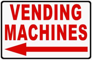 vending machines w/left arrow sign. 12x18 metal. soda candy machine