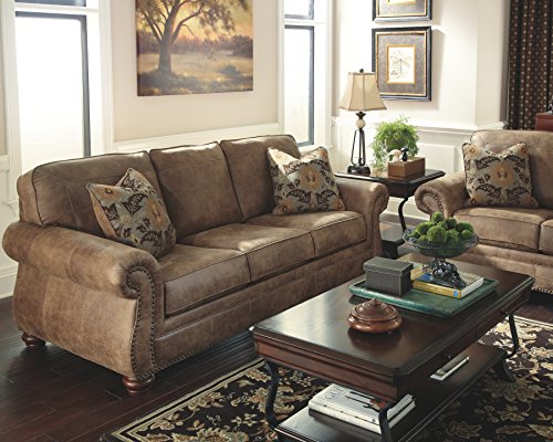 Signature Design by Ashley Larkinhurst Faux Leather Sofa with Nailhead Trim and 2 Accent Pillows, Brown