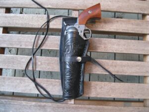 black left handed tooled leather gun holster