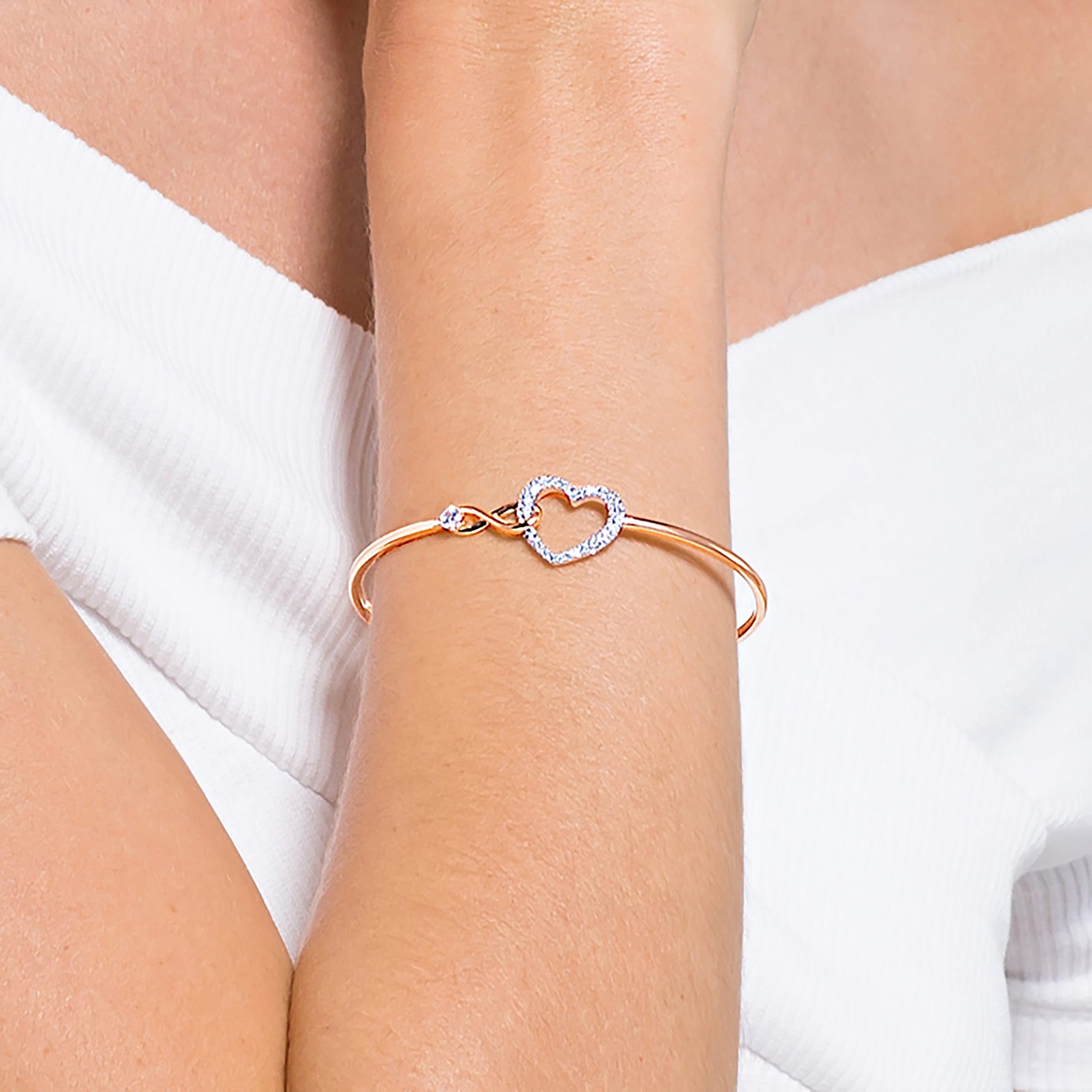 SWAROVSKI Infinity Heart Women's Bangle Bracelet with a Rose-Gold Tone Plated Bangle, Clear Crystals and Lobster Clasp