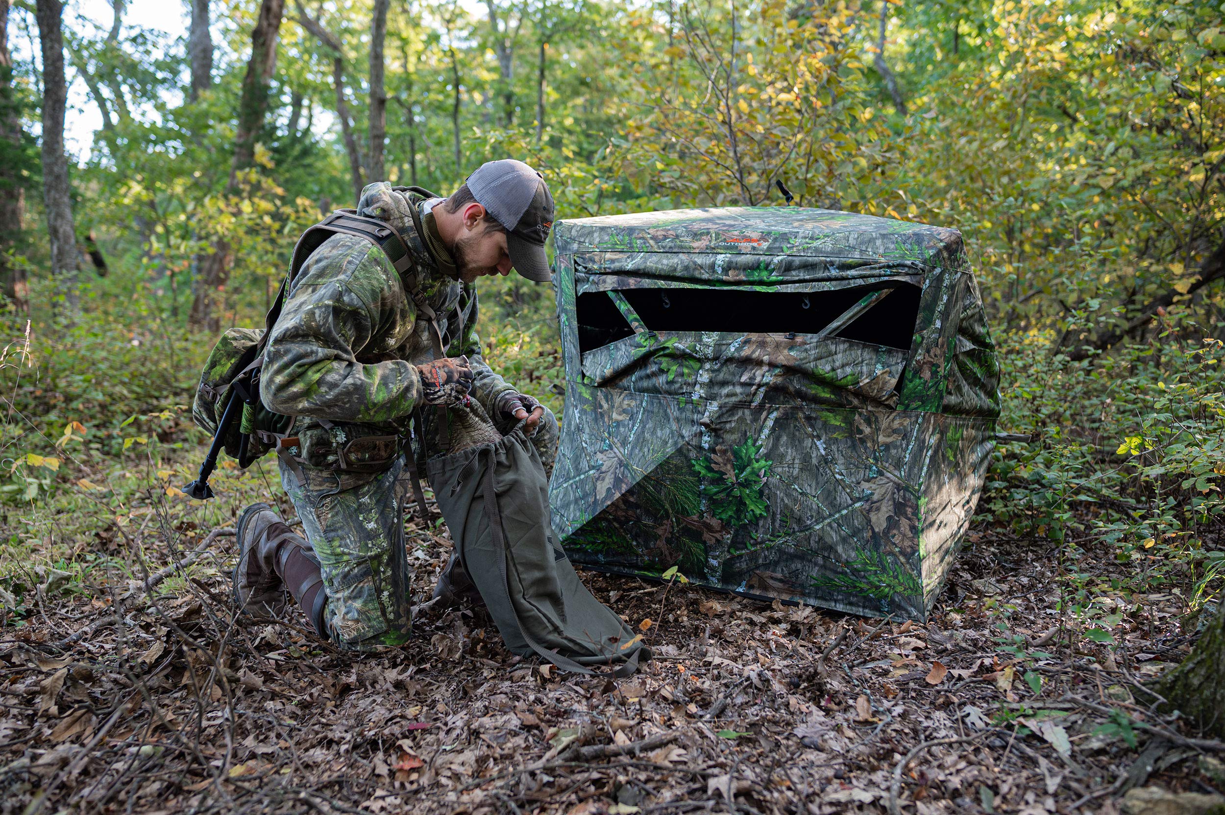 ALPS OutdoorZ Deception Pop Up Hunting Blind Featuring Unique Small Footprint Four Hub Design, Wide Windows with Silent Open, Extra Large Easy Access Door, Mossy Oak Obsession