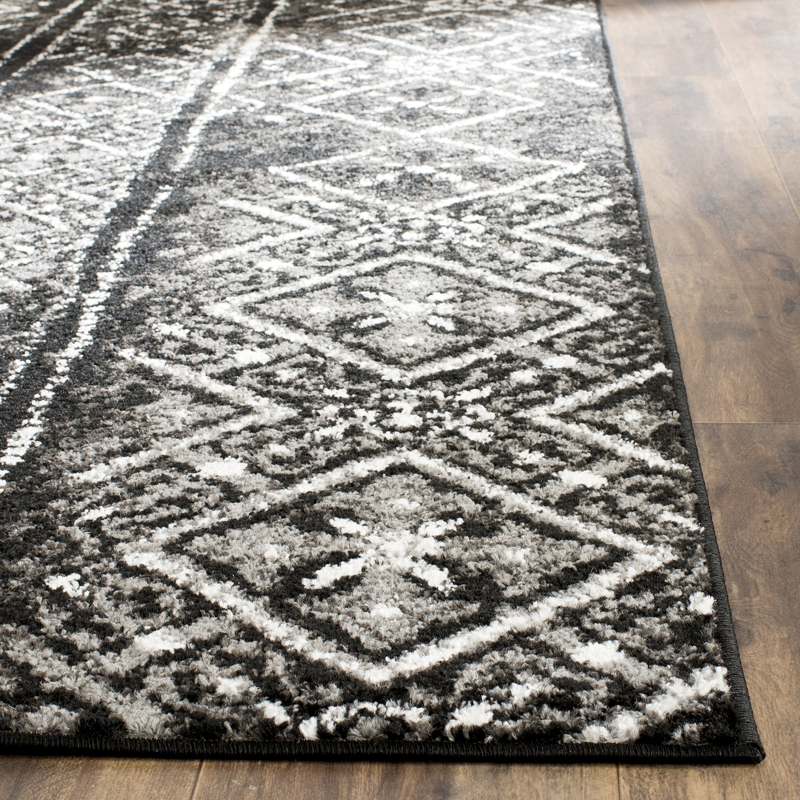 SAFAVIEH Adirondack Collection Area Rug - 9' x 12', Black & Silver, Moroccan Boho Distressed Design, Non-Shedding & Easy Care, Ideal for High Traffic Areas in Living Room, Bedroom (ADR111C)