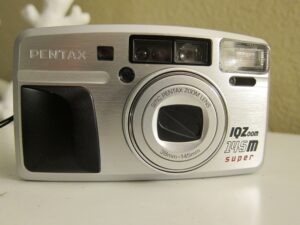 pentax iq zoom 145 m super quartz date 35mm camera (wood grip)