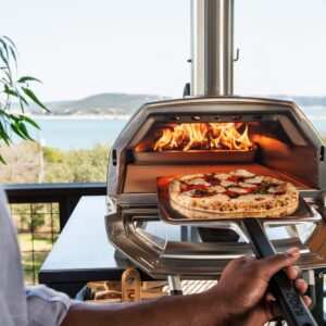 Offer - Save On Ooni Karu 16 Cover and Ooni 14" Perforated Peel with Ooni Karu 16 Mult-Fuel Pizza Oven – Cook in the Backyard and Beyond with this Outdoor Kitchen Pizza Making Oven Bundle