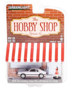 greenlight collectible 1979 coupe ghia silver metallic and woman in a dress figurine the hobby shop series 12 1/64 diecast model car by greenlight 97120 b