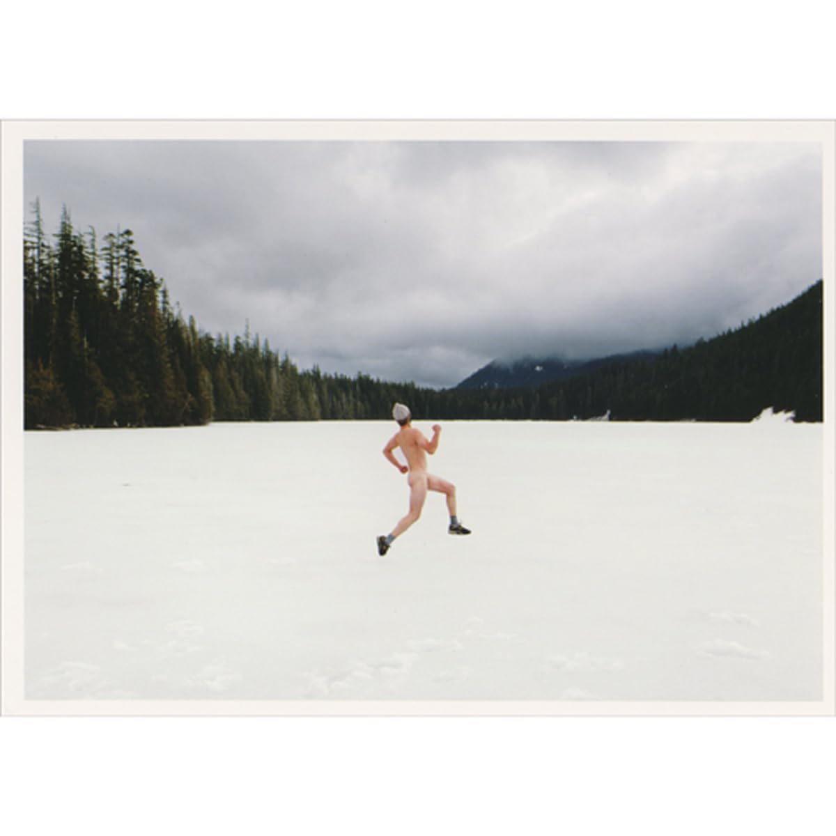 Palm Press Streaker with Winter Hat Jogging Across Frozen Lake Surrounded by Forest and Hills Box of 10 Humorous/Funny Christmas Cards