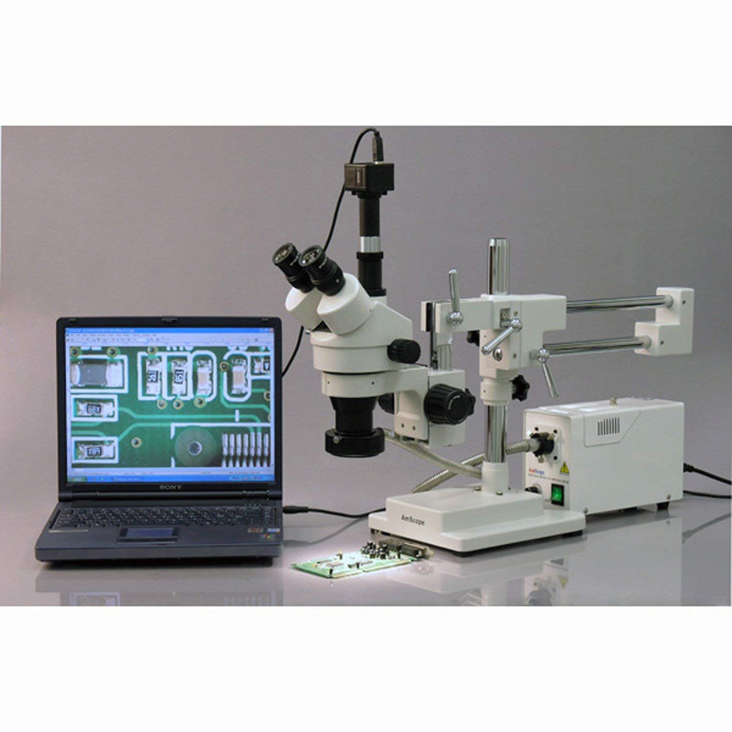 AmScope SM-4TPY Professional Trinocular Stereo Zoom Microscope with Simultaneous Focus Control, WH10x Eyepieces, 7X-90X Magnification, 0.7X-4.5X Zoom Objective, Ambient Lighting, Double-Arm Boom Stand, Includes 2.0X Barlow Lens