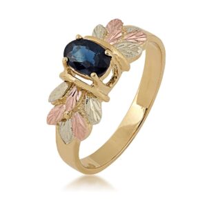 10k yellow gold sapphire .53 with a bouquet of 12k green and rose black hills gold hand sculpted leaves size 9