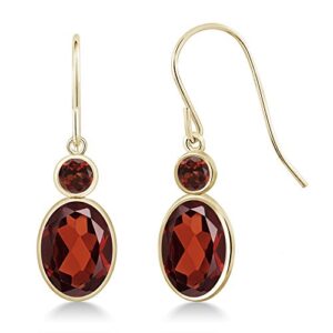 Gem Stone King 14K Yellow Gold Red Garnet Hook French Fish Ear Wire Dangle Earrings For Women (3.04 Cttw, Gemstone January Birthstone, Oval 8X6MM, Round 3MM)