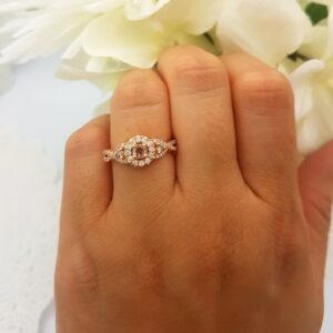 Dazzlingrock Collection Morganite,Champagne & White Diamond 3 Stone Swirl Halo Engagement Ring in 10K Rose Gold, Size 7