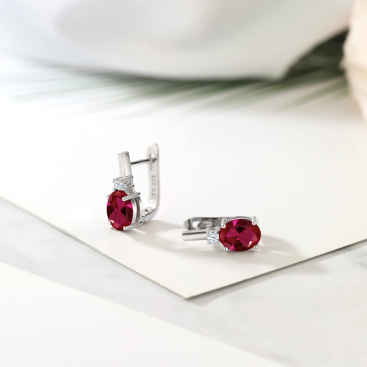 Gem Stone King 925 Sterling Silver Red Created Ruby and White Zirconia Earrings For Women (4.09 Cttw, Gemstone July Birthstone, Oval 9X7MM)