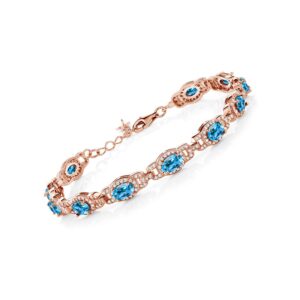 Gem Stone King 18K Rose Gold Plated Silver Oval Swiss Blue Topaz Tennis Bracelet For Women (9.65 Cttw, Gemstone Birthstone, 7 Inch With 1 Inch Extender)