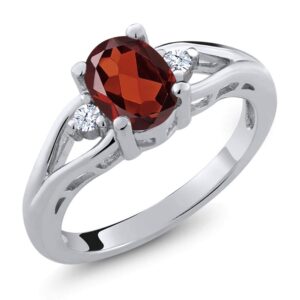 gem stone king 925 sterling silver red garnet and white topaz 3 stone engagement ring for women | 1.28 cttw | oval 8x6mm | round 2mm | gemstone january birthstone | size 8