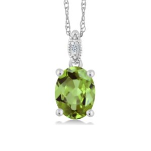 Gem Stone King 10K White Gold Green Peridot and Diamond Pendant Necklace For Women (1.80 Cttw, Gemstone Birthstone, Oval 9X7MM With 18 Inch Chain)