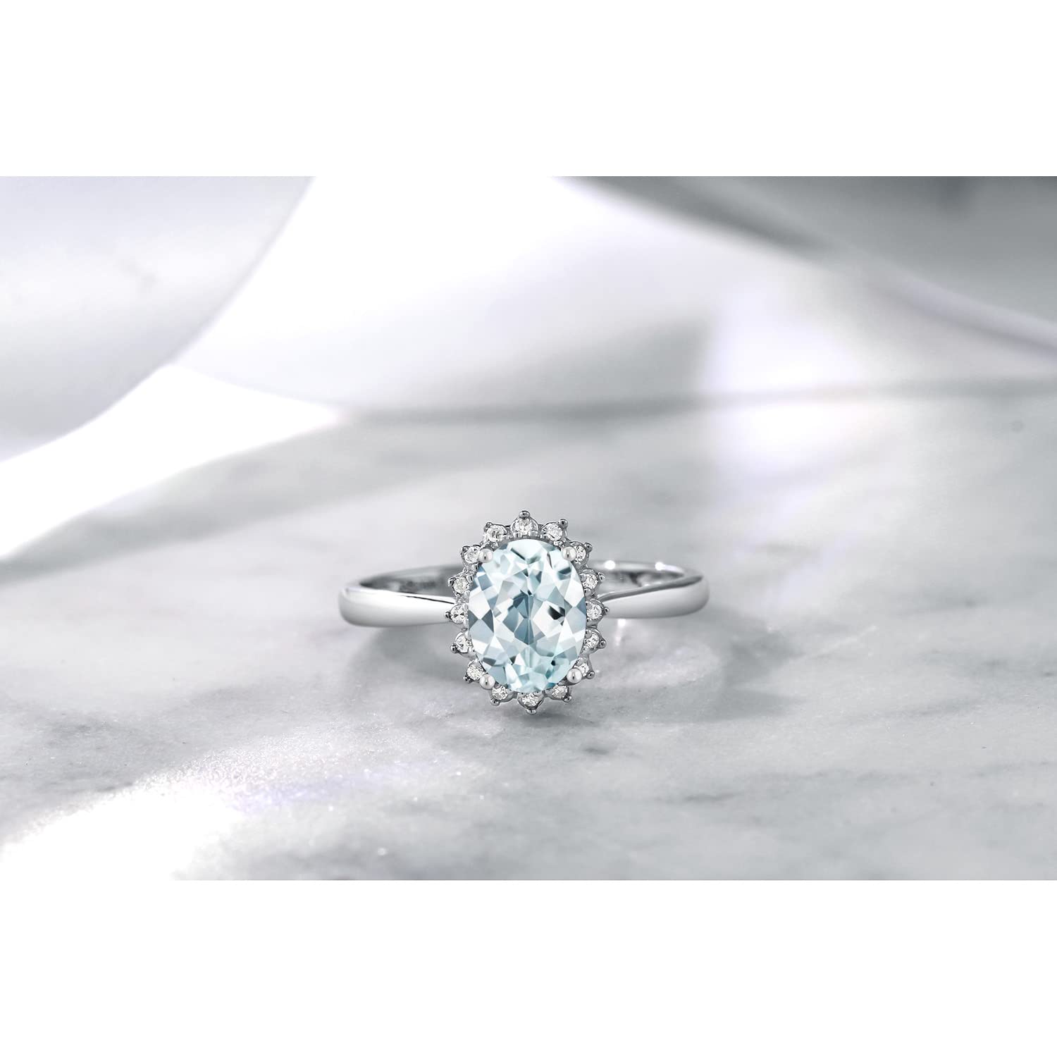 Gem Stone King 10K White Gold Sky Blue Aquamarine and Diamond Halo Engagement Ring For Women (1.25 Cttw, Oval 8X6MM, Size 9)