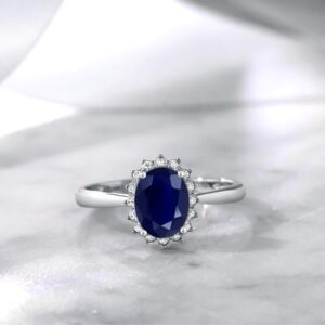 Gem Stone King 10K White Gold Blue Sapphire and Diamond Halo Engagement Ring For Women (1.85 Cttw, Oval 8X6MM, Size 7)