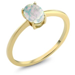 gem stone king 10k yellow gold white simulated opal solitaire engagement ring for women | 0.63 cttw | oval cabochon 7x5mm | gemstone october birthstone | available in size 5-10