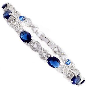 rizilia tennis bracelet & oval cut cz [simulated blue sapphire] in white gold plated, 7"