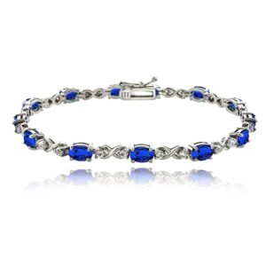 B. BRILLIANT Sterling Silver Created Blue Sapphire 6x4mm Oval Infinity Bracelet with White Topaz Accents