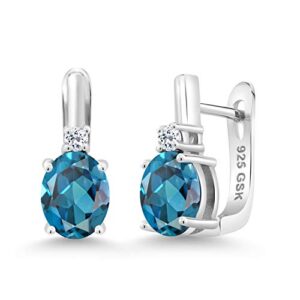 gem stone king 925 sterling silver london blue topaz and white topaz earrings for women (3.76 cttw, gemstone november birthstone, oval 9x7mm)