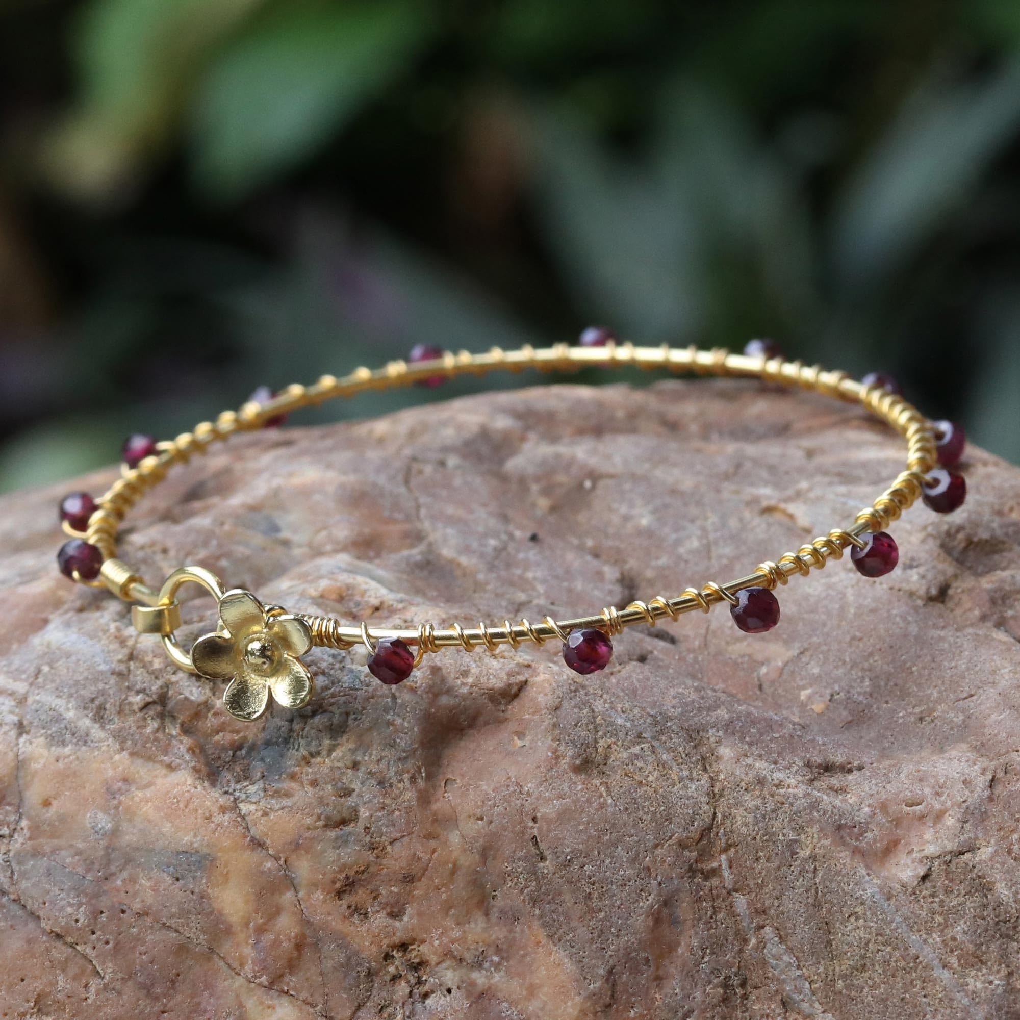 NOVICA Artisan Gold Plated Garnet Bangle Bracelet Floral from Thailand Red Tone Birthstone [7.5 in Inner Circ. 4 mm W] ' Floral Berries'