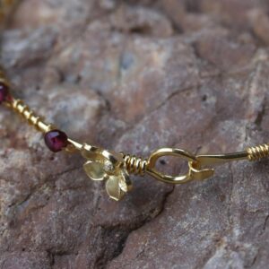 NOVICA Artisan Gold Plated Garnet Bangle Bracelet Floral from Thailand Red Tone Birthstone [7.5 in Inner Circ. 4 mm W] ' Floral Berries'