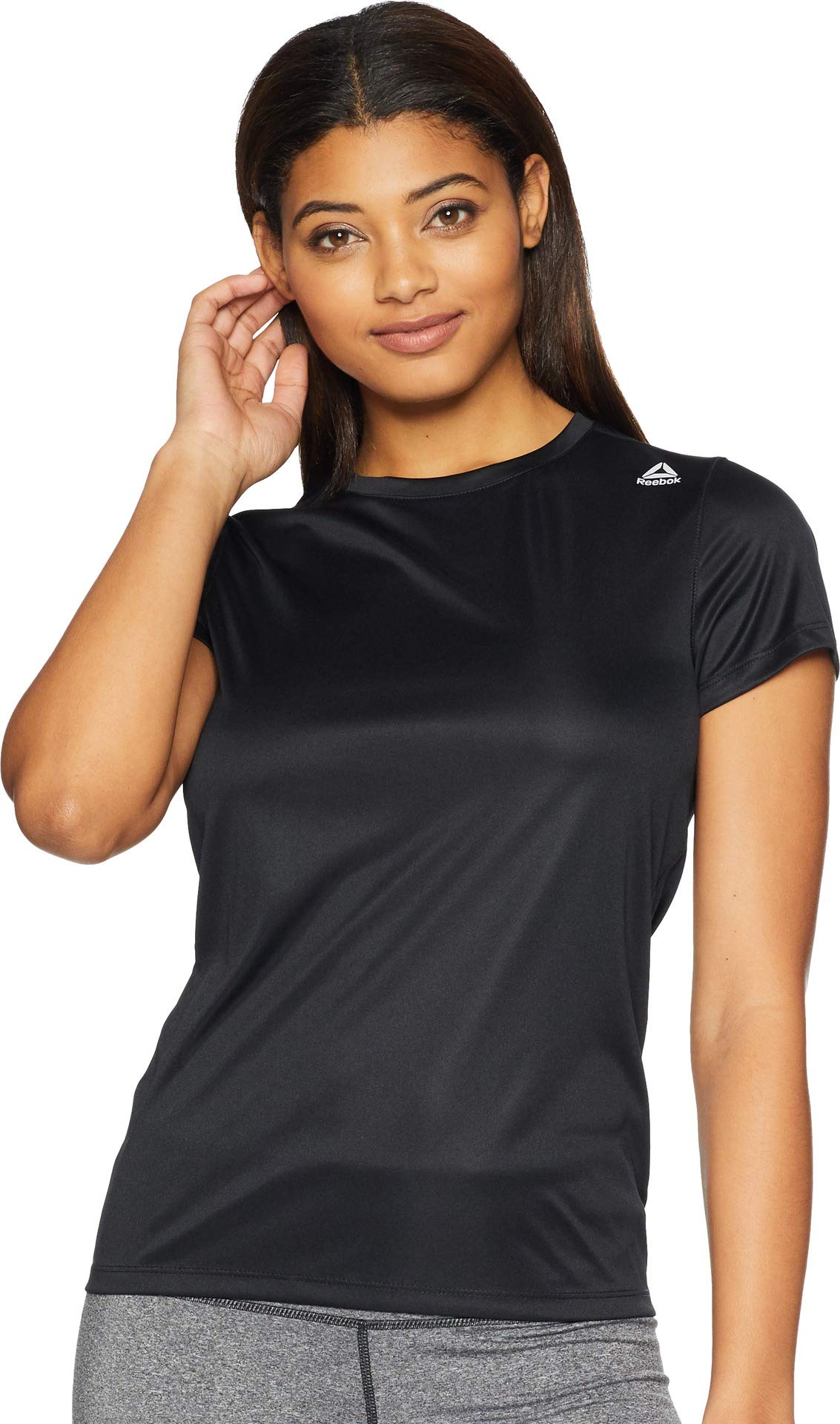 Reebok running tee with a reflective stripe on the back and a reflective Reebok delta logo