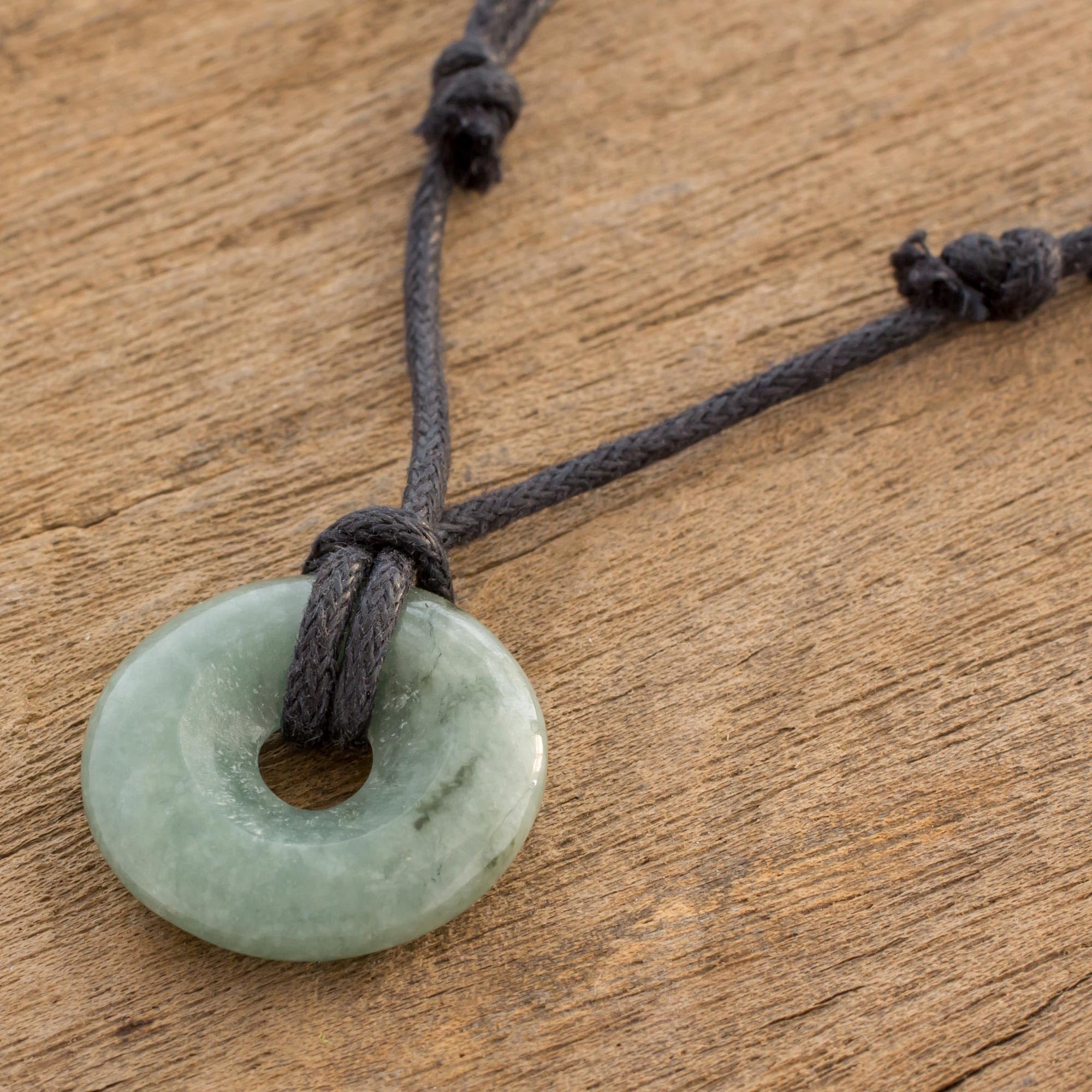 NOVICA Artisan Handmade Jewelry Jade Circular Pendant Necklace Light Green | Jade Necklace with Black Cotton Cord | Green Jade Natural Gemstone Necklace for Women | Mayan Themed Necklace from Guatemala 'Circle of Love'