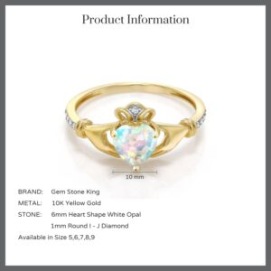 Gem Stone King 10K Yellow Gold Irish Celtic Claddagh White Simulated Opal and Diamond Accent Ring For Women (0.81 Cttw, Available in size 5, 6, 7, 8, 9)