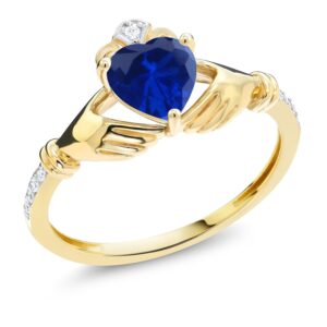 Gem Stone King 10K Yellow Gold Irish Celtic Claddagh Blue Created Sapphire and Diamond Accent Women Ring (0.86 Cttw, Available In Size 5, 6, 7, 8, 9)