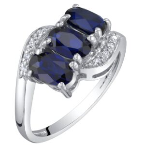 PEORA Created Blue Sapphire and Genuine Diamond Three Stone Anniversary Ring for Women 14K White Gold, 1.50 Carats total Oval Shape, Size 6