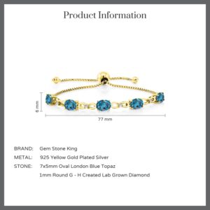 Gem Stone King 18K Yellow Gold Plated Silver London Blue Topaz and White Lab Grown Diamond Tennis Bracelet For Women (5.02 Cttw, Gemstone Birthstone, Oval 7x5MM, Fully Adjustable Up to 9 Inch)