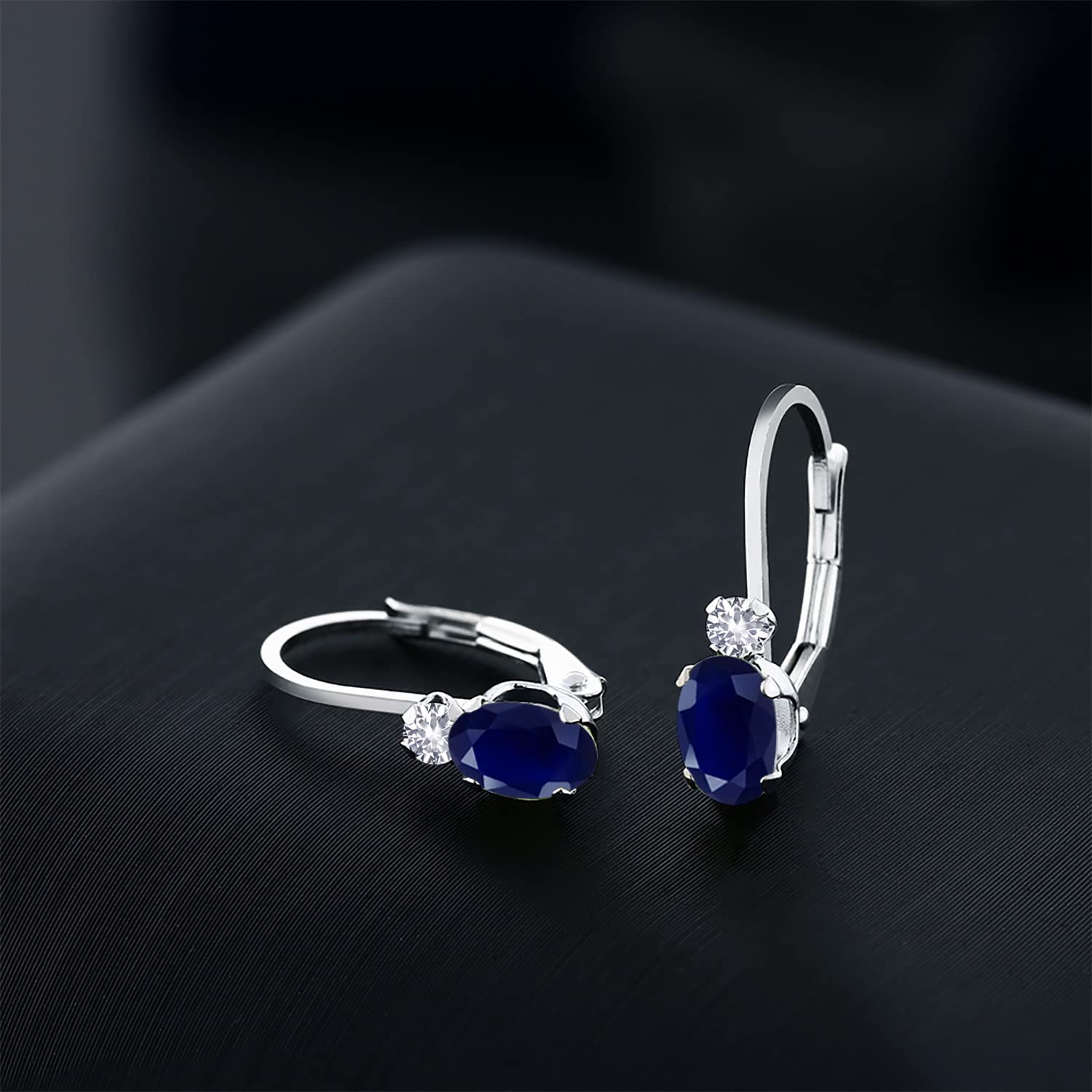 Gem Stone King 14K White Gold Blue Sapphire and White Created Sapphire Leverback Earrings For Women | 1.18 Cttw | Gemstone September Birthstone | Oval 6X4MM, Round 2MM | 3/4 Inch