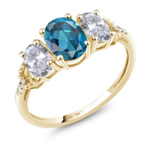 Gem Stone King 10K Yellow Gold London Blue Topaz White Topaz and Diamond Accent Engagement Ring For Women (2.22 Cttw, Oval Gemstone Birthstone, Available in size 5, 6, 7, 8, 9)