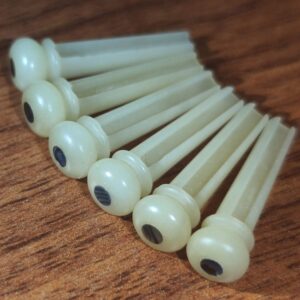 vencetmat unbleached acoustic guitar bridge pins,made of real bones,inlaid abalone dot, bridge pin puller was included