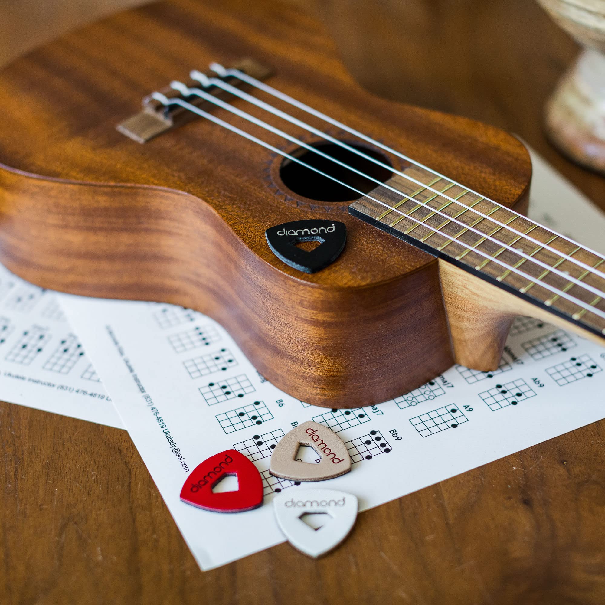 Leather Ukulele Picks with Diamond-Shaped Cutout Hole for Enhanced Grip Never Drop your Pick while Playing also works as a Guitar Pick or Bass Pick 100% Genuine Leather 4-Pack