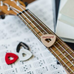 Leather Ukulele Picks with Diamond-Shaped Cutout Hole for Enhanced Grip Never Drop your Pick while Playing also works as a Guitar Pick or Bass Pick 100% Genuine Leather 4-Pack