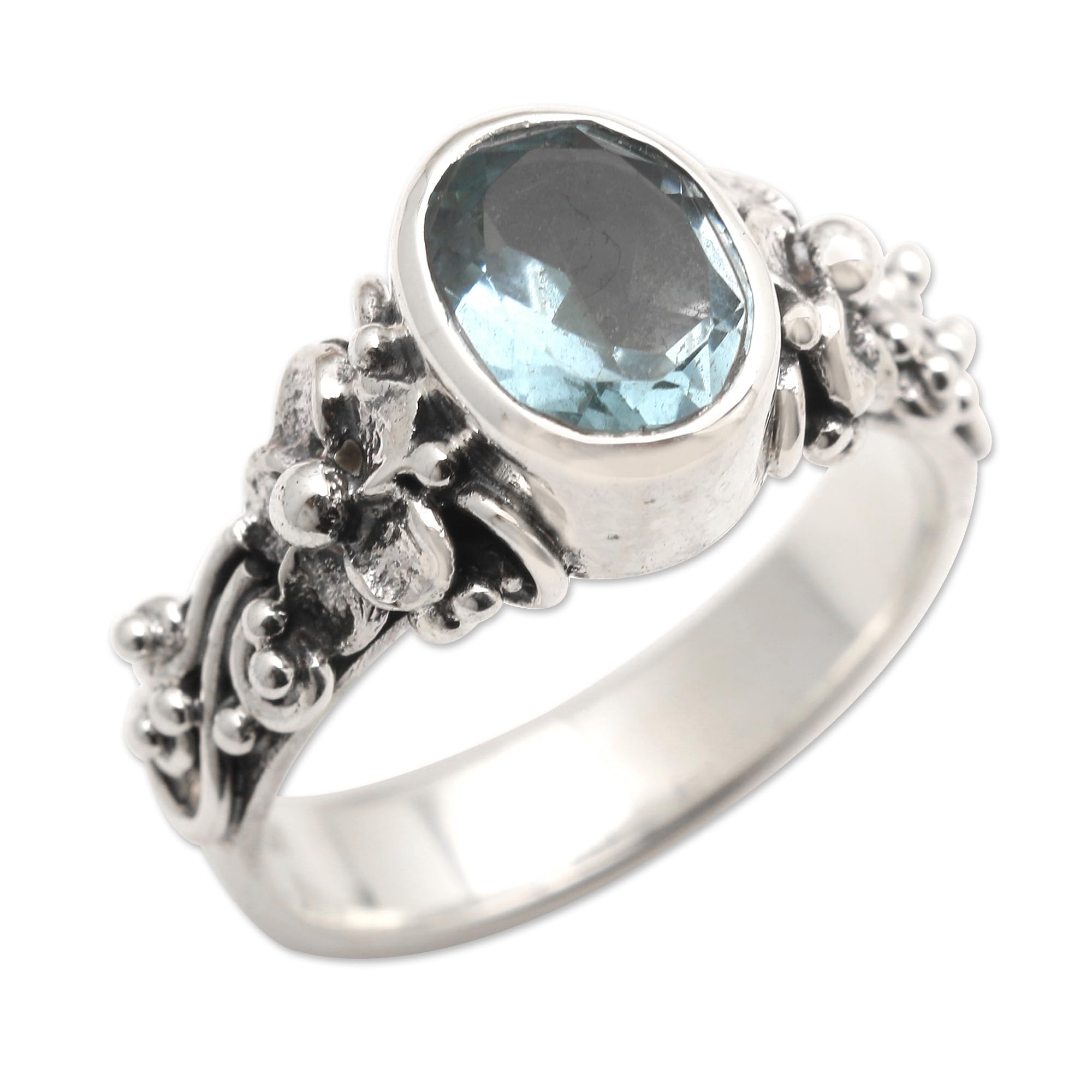 NOVICA Artisan Handmade Blue Topaz Single Stone Ring Oval Cut Silver with Floral Design Sterling Cocktail Indonesia Serenity Birthstone [crownbezel 0.4 in L x 0.3 in W x 0.3 in H Band Width 4 mm W]