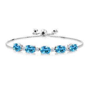 gem stone king 925 sterling silver swiss blue topaz and white topaz tennis bracelet for women (7.84 cttw, center stone: 8x6mm, small stones: 2.5mm, gemstone birthstone, fully adjustable up to 9 inch)