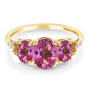 Gem Stone King 10K Yellow Gold Pink Mystic Topaz 3-Stone Engagement Ring | 2.34 Cttw | Oval 8X6MM and 6X4MM | 3 Stone Wedding Anniversary Promise Ring For Women (Size 5)