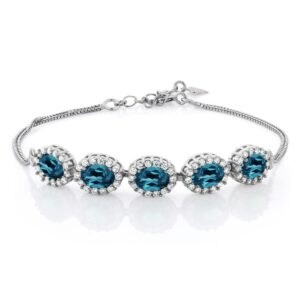 gem stone king 925 sterling silver london blue topaz tennis bracelet for women (5.54 cttw, gemstone birthstone, oval 7x5mm, 7 inch + 1.5 inch extender)