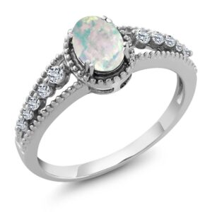 gem stone king 925 sterling silver white simulated opal and white topaz engagement ring for women (1.21 cttw, oval cabochon 7x5mm, available 5,6,7,8,9) (size 7)