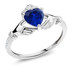 Gem Stone King 10K White Gold Blue Created Sapphire and White Diamond Irish Celtic Claddagh Ring For Women (0.86 Cttw, Heart Shape 6MM, Gemstone Birthstone, Available in size 5, 6, 7, 8, 9)