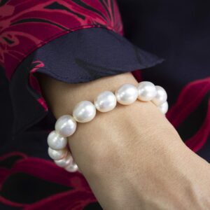 9.5mm-11mm AAAA White Semi-Baroque Oval Freshwater Cultured Pearl Bride & Bridesmaid Stretch Strand Bracelet - 8"