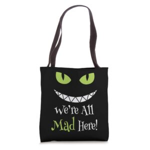 we're all mad here grin tote bag