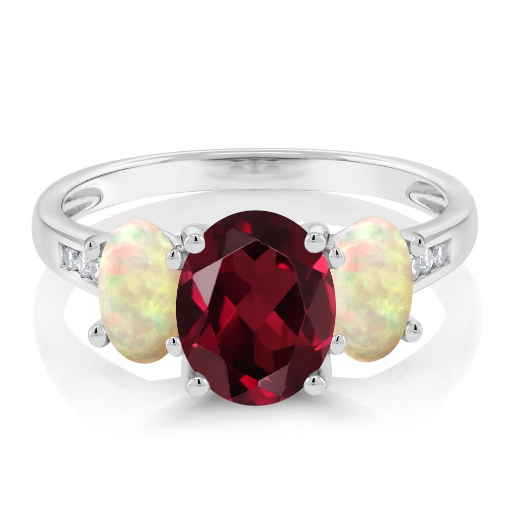 10K White Gold Red Rhodolite Garnet White Ethiopian Opal and White Diamond Oval 3-Stone Engagement Ring For Women (1.99 Cttw, Gemstone January Birthstone, Available In Size 5, 6, 7, 8, 9)